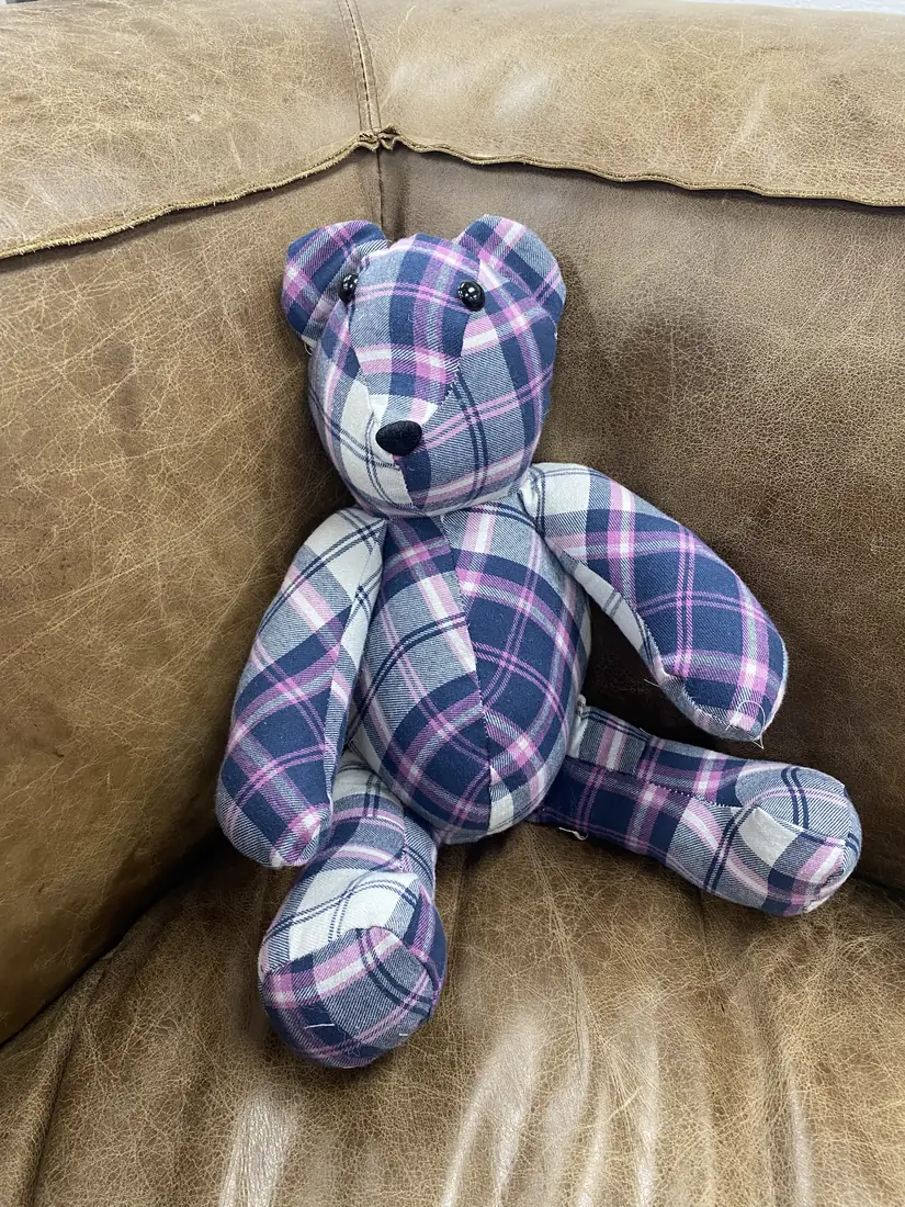 A memory bear made from a plaid flannel shirt