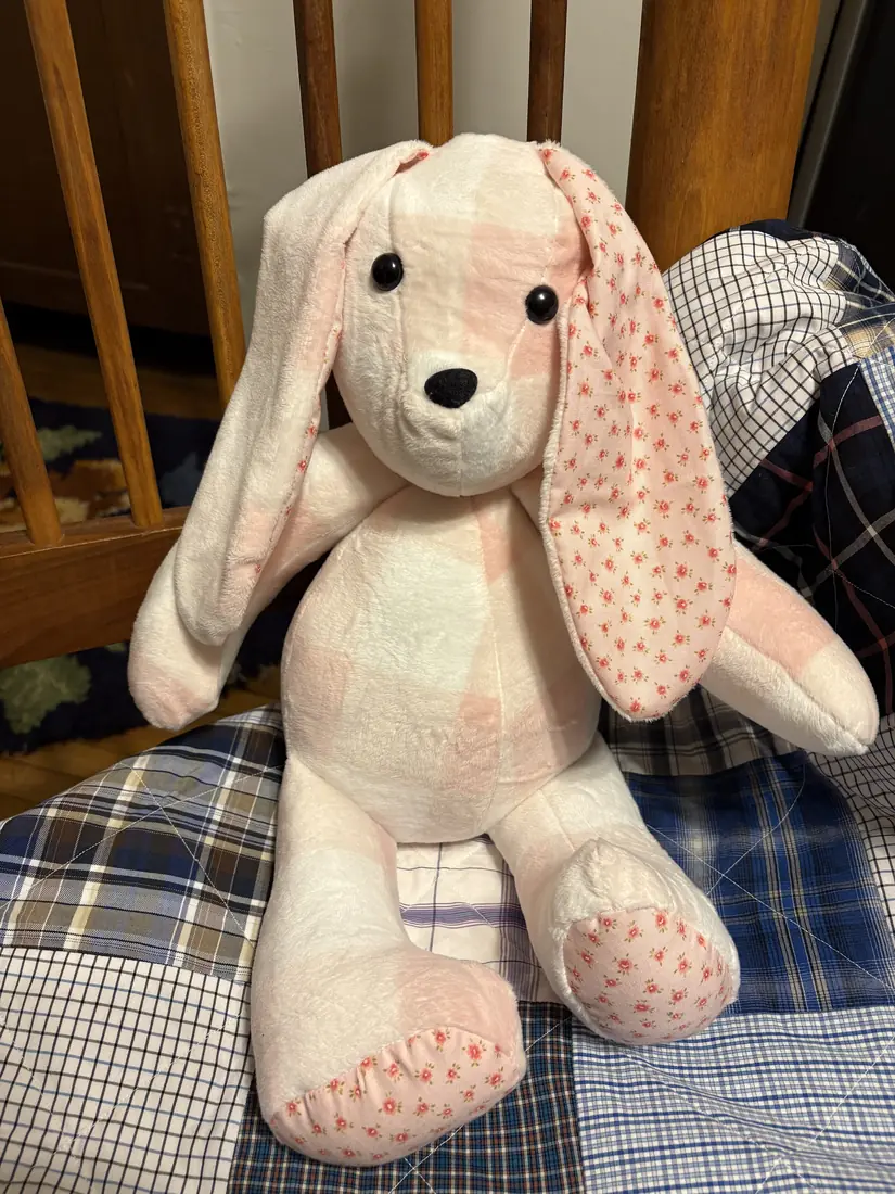 A soft pink bunny with rosebud ears and paws