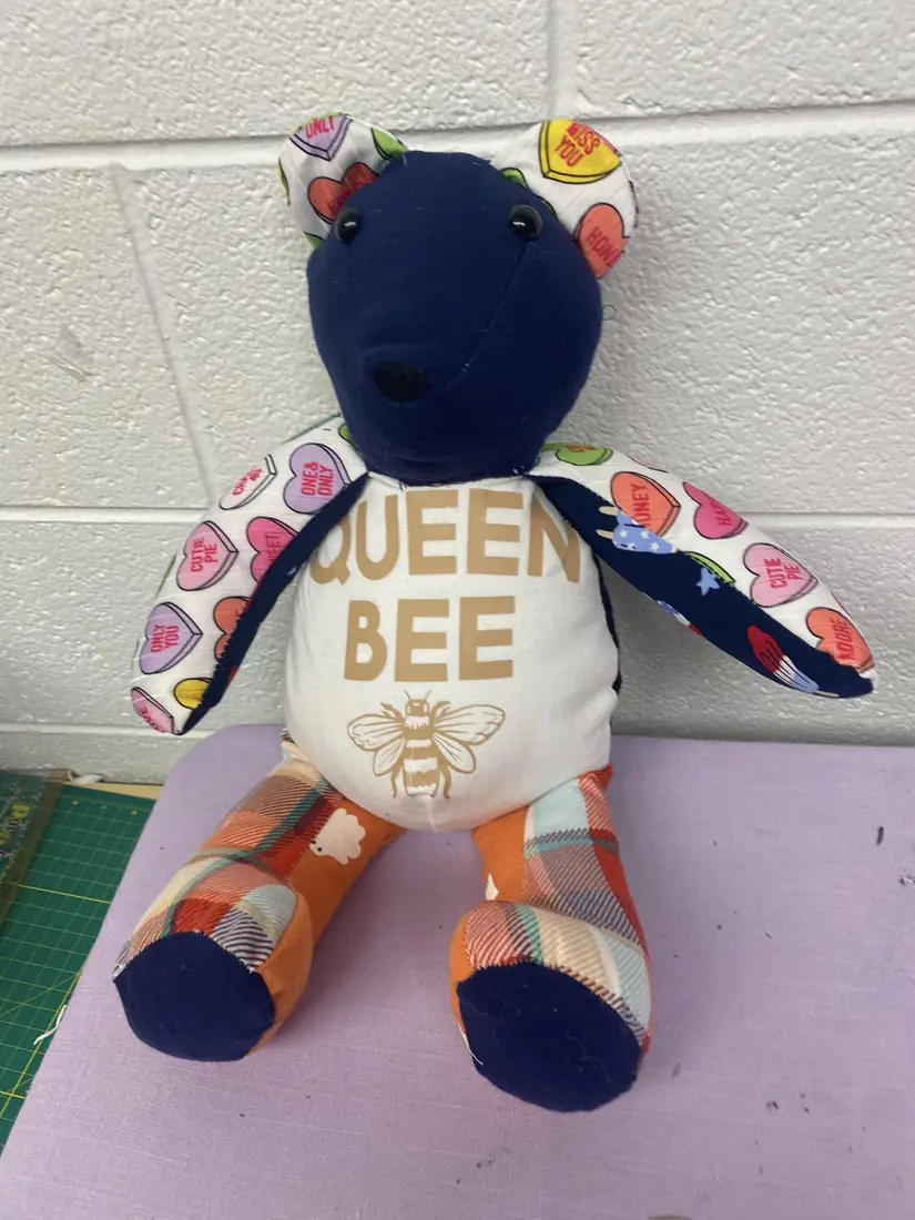A Queen Bee memory bear made from baby clothes
