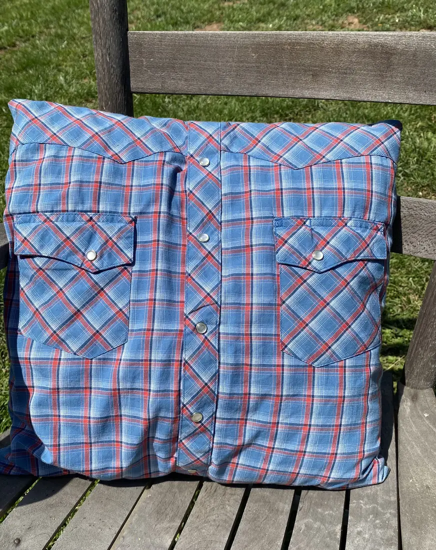 A memory pillow made from a western snap shirt, pockets and all