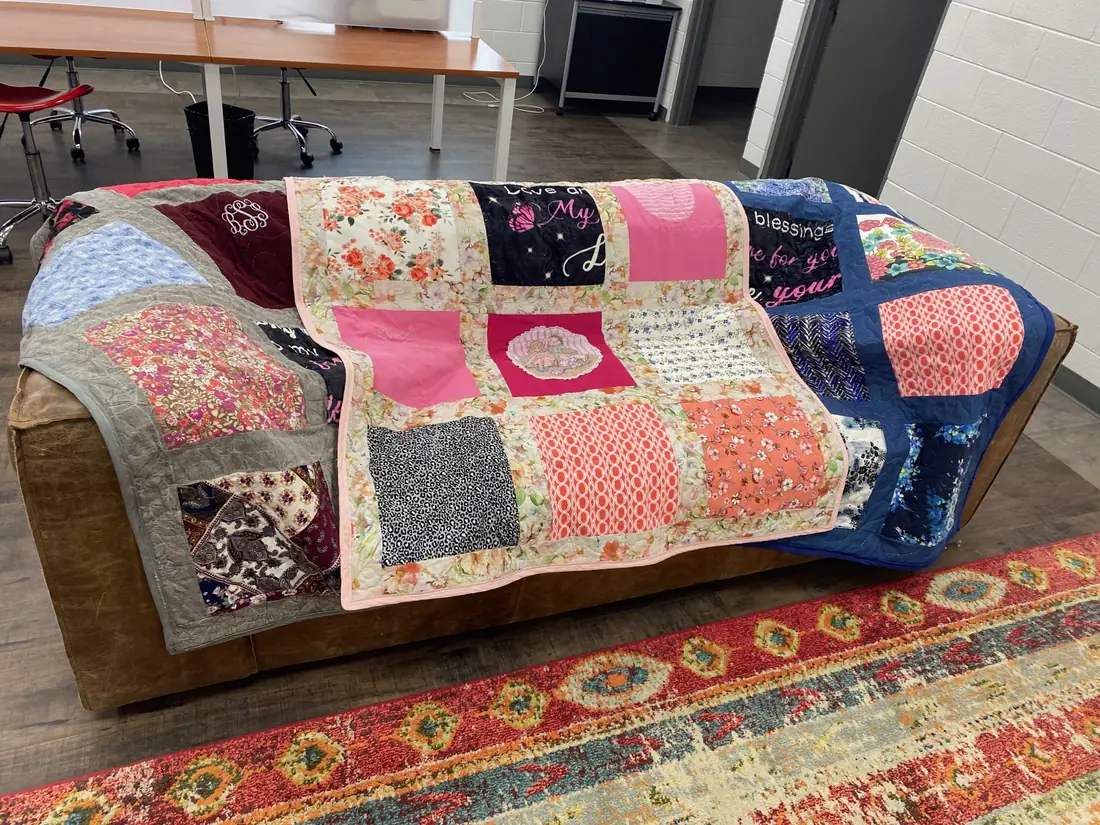 Three memory quilts made from a loved one's clothes